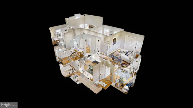 a kitchen with stainless steel appliances a refrigerator a stove a microwave oven a sink with island and chairs