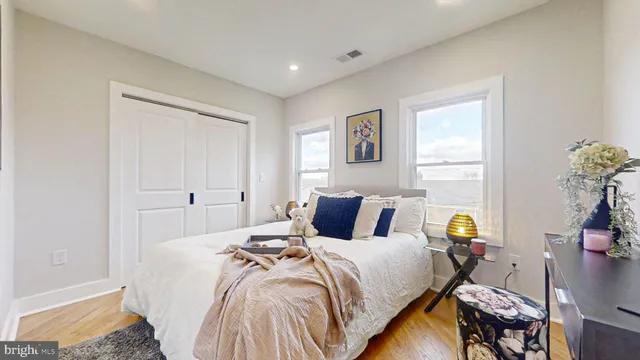 a living room with furniture a fireplace and a window