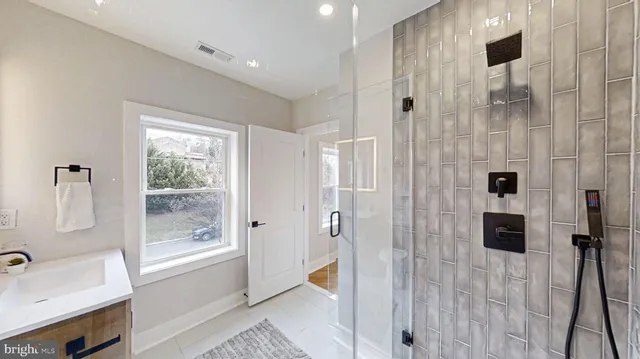 a bedroom with bed and a painting