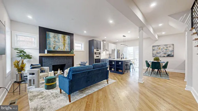 a view of a small space with wooden floor and a window