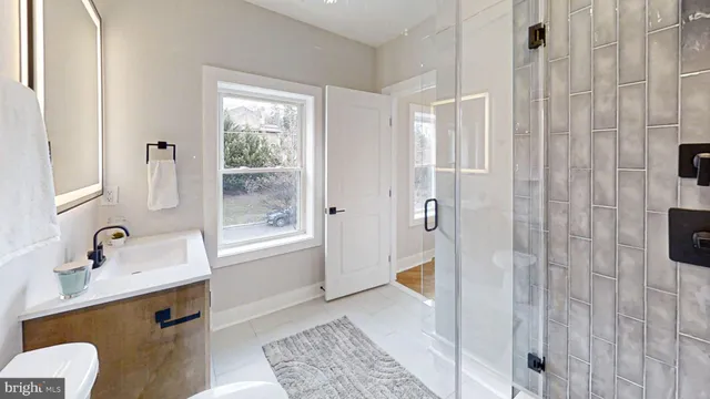 a living room with furniture potted plant and a fireplace