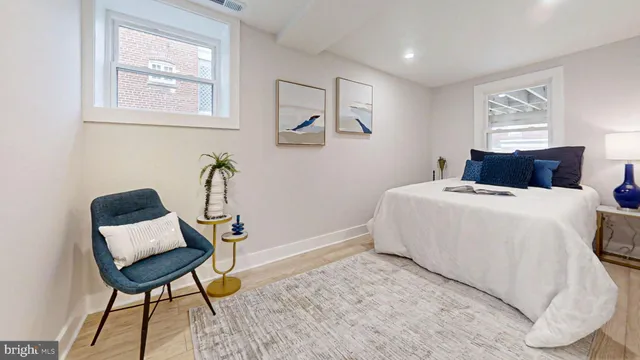 a view of a chair and tables in the balcony