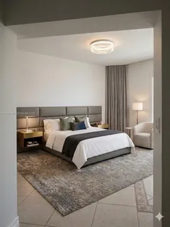 a bedroom with a bed and a lamp