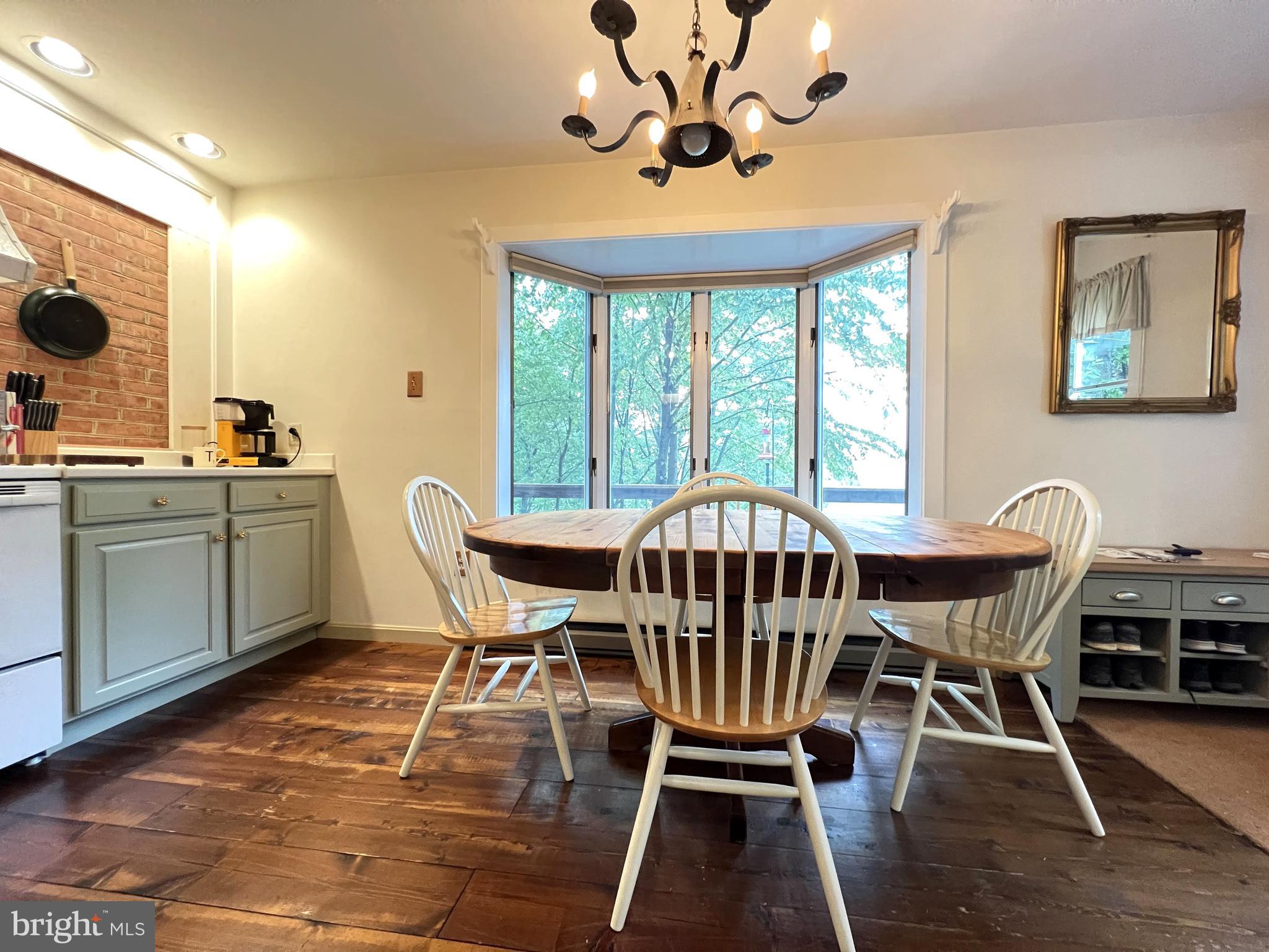 259 Riley Hollow Road Huntly, VA 22640 - Photo 13 of 33 a view of a dining room with furniture window and wooden floor
