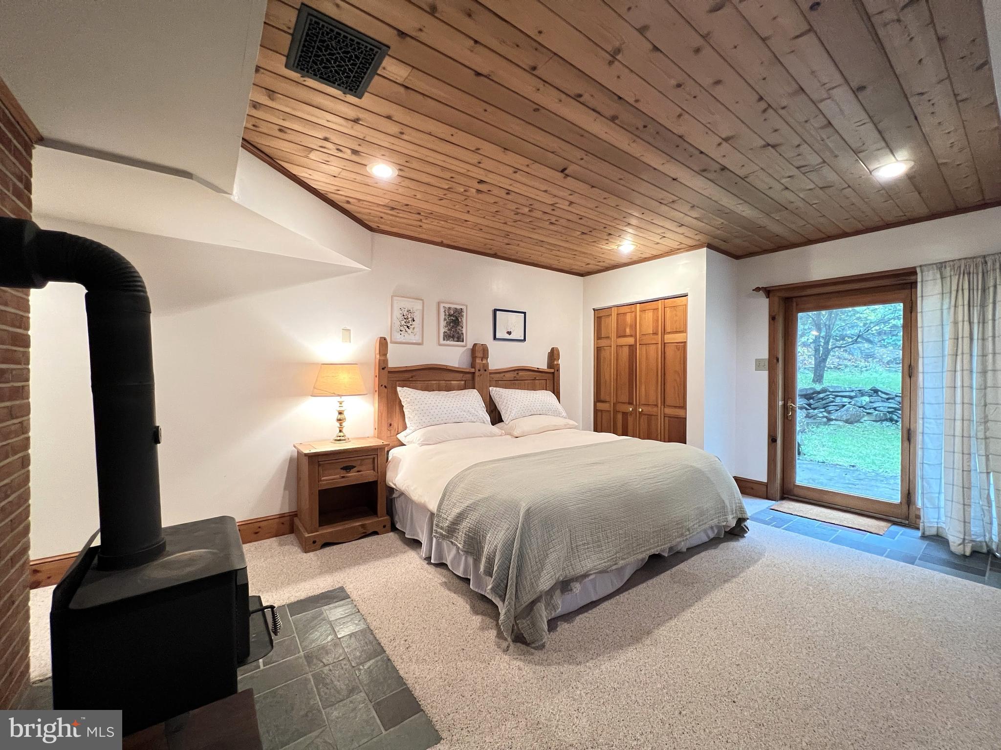 259 Riley Hollow Road Huntly, VA 22640 - Photo 16 of 33 a spacious bedroom with a large bed and a flat tv screen on dresser