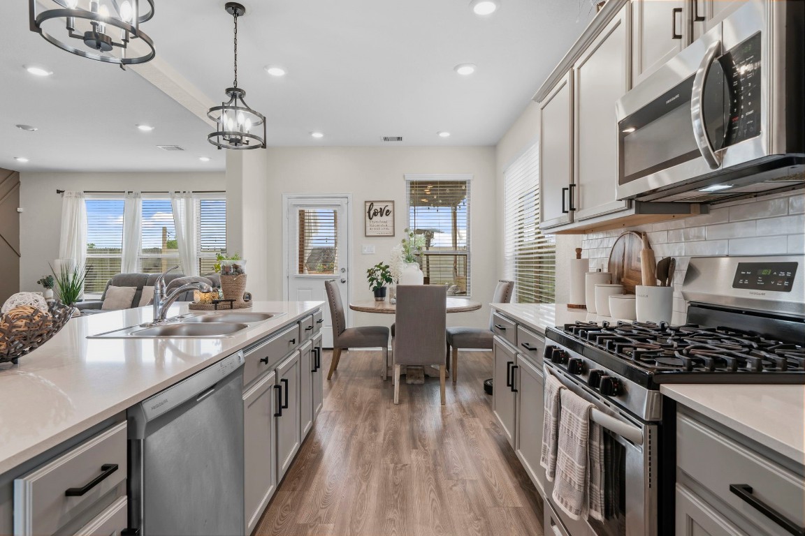 5142 Dunstable Manor Lane Rosharon, TX 77583 - Photo 11 of 30 Designed with an open-concept layout that enhances flow and connectivity throughout the home