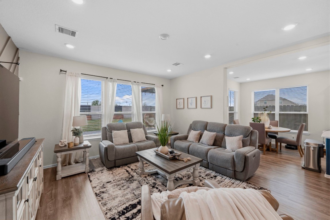 5142 Dunstable Manor Lane Rosharon, TX 77583 - Photo 15 of 30 layout that connects seamlessly to the kitchen and dining spaces.