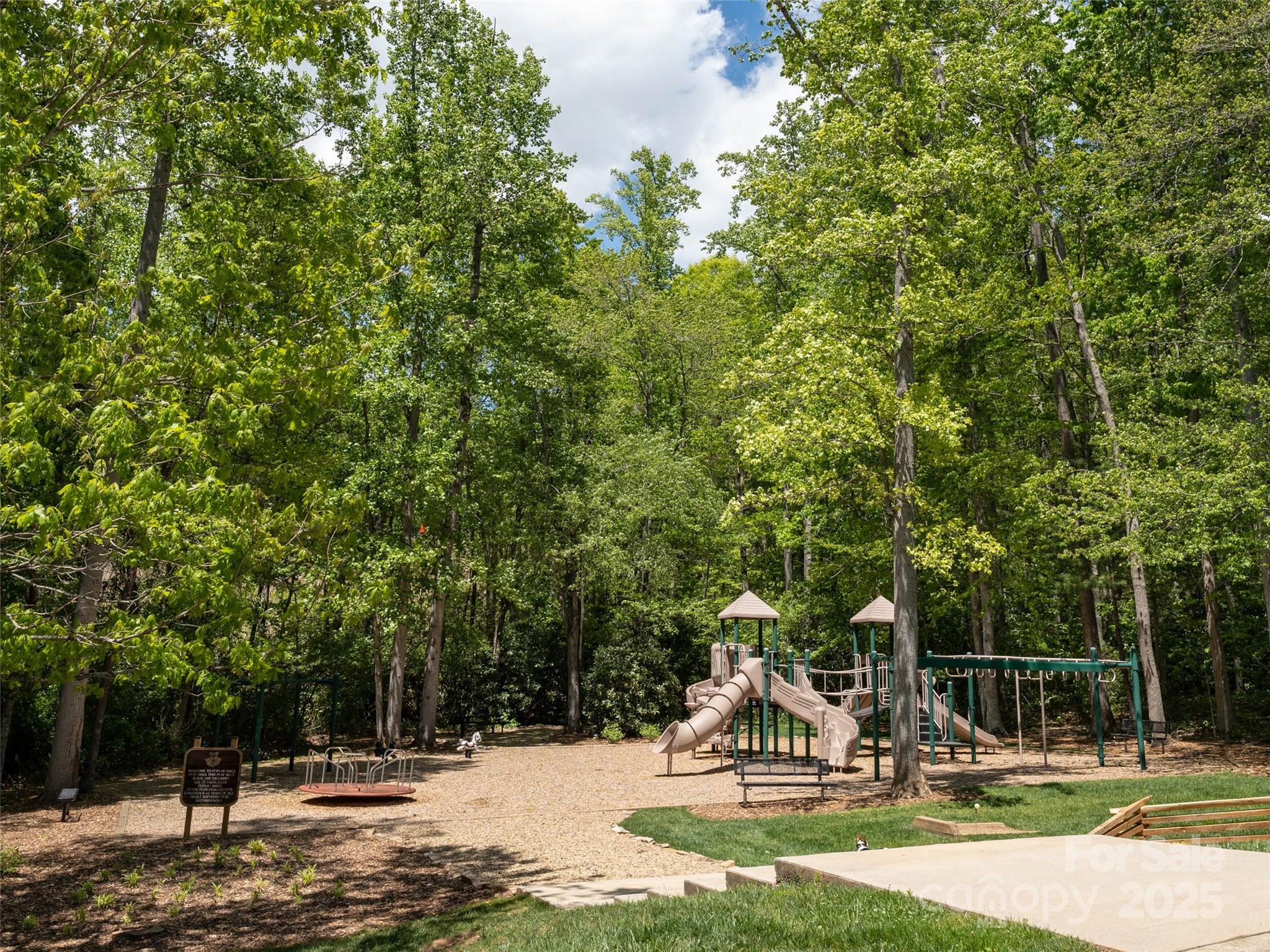 26 Fall Mountain Road, Unit 58 Asheville, NC 28803 - Photo 22 of 25 a view of a park with swings and slides