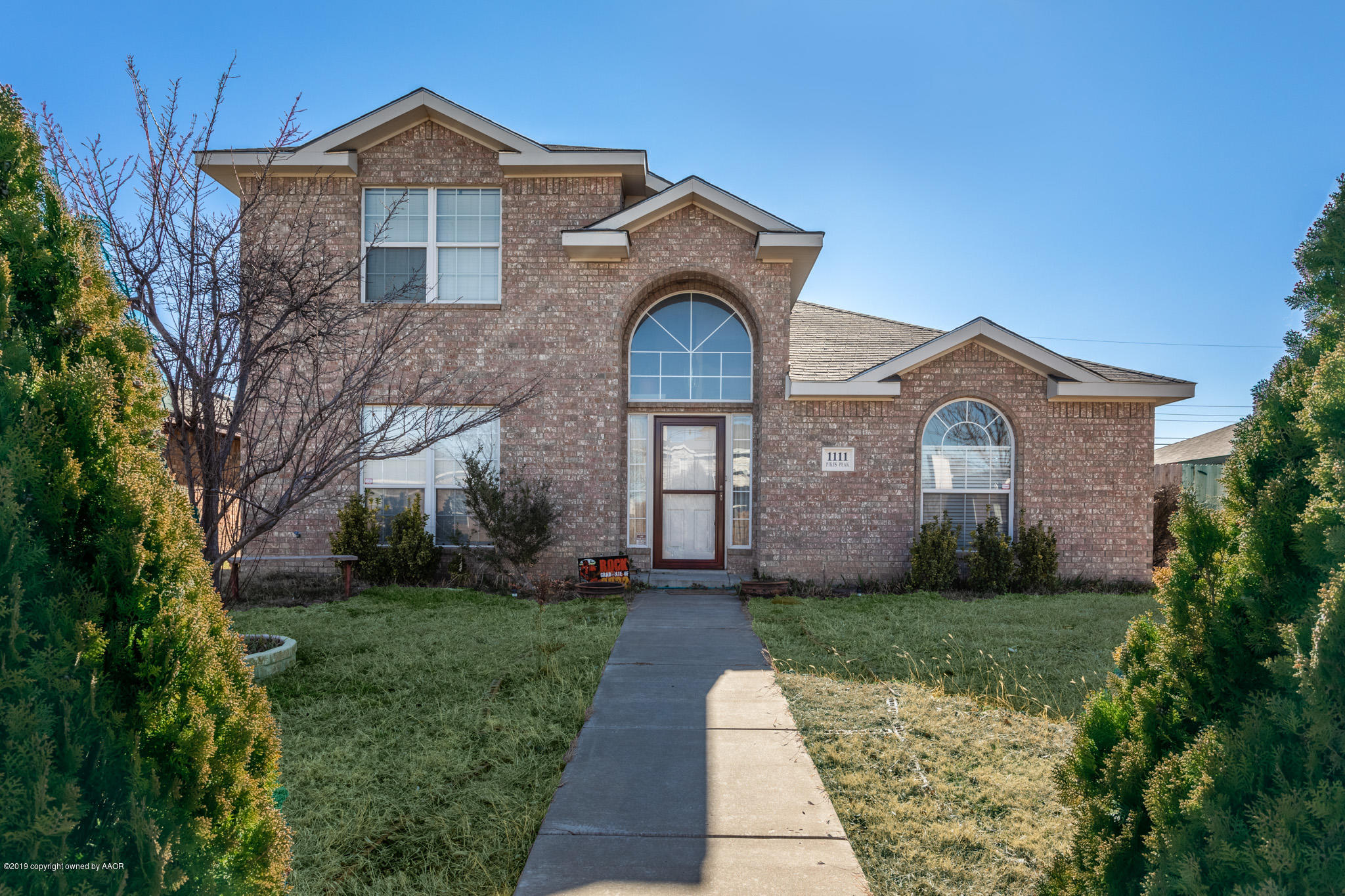 1111 Pikes Peak Drive Amarillo, TX 79110 - Photo 1 of 15 a front view of a house with garden