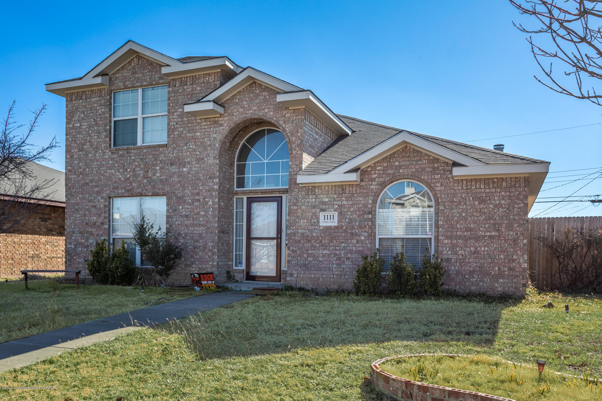 1111 Pikes Peak Drive Amarillo, TX 79110 - Photo 2 of 15 a front view of a house with garden