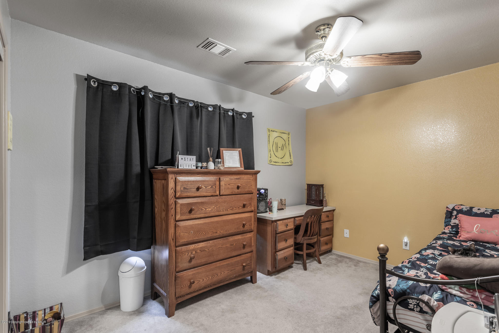 1111 Pikes Peak Drive Amarillo, TX 79110 - Photo 12 of 15 a room with a baby bed furniture and a window
