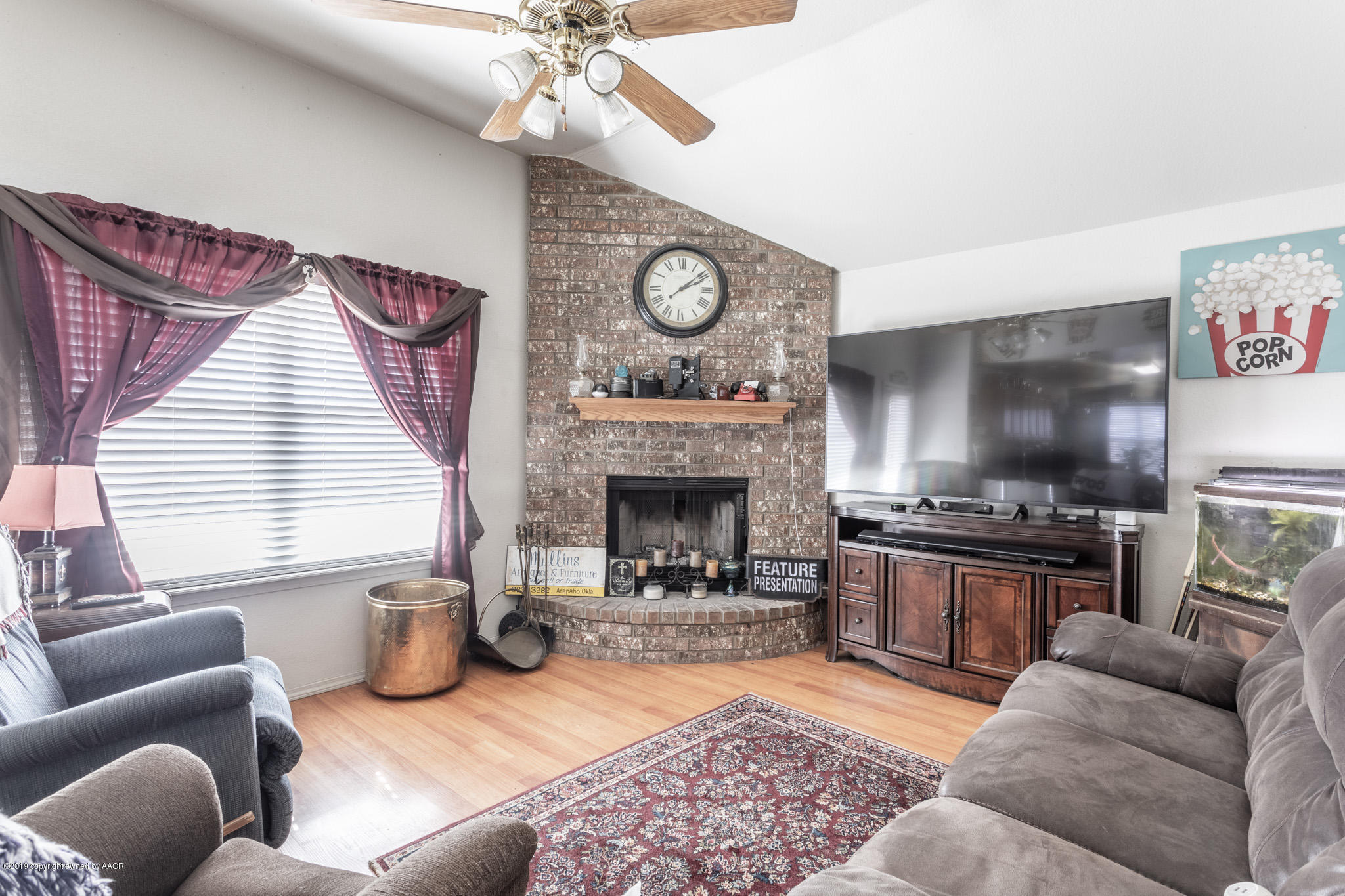 1111 Pikes Peak Drive Amarillo, TX 79110 - Photo 6 of 15 a living room with furniture a fireplace and window