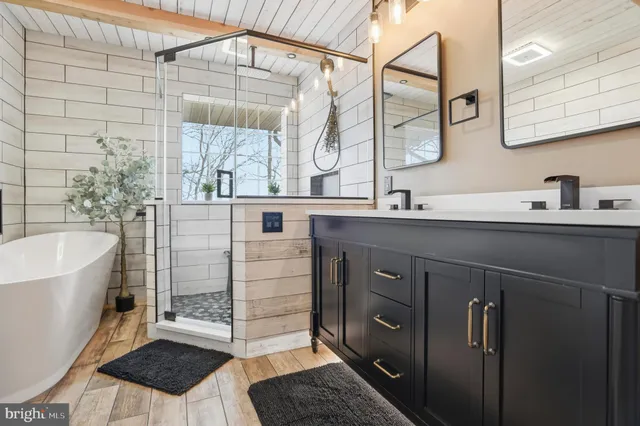 a bathroom with a double vanity sink and mirror