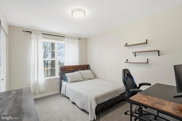 a bathroom with a bath tub with a shower