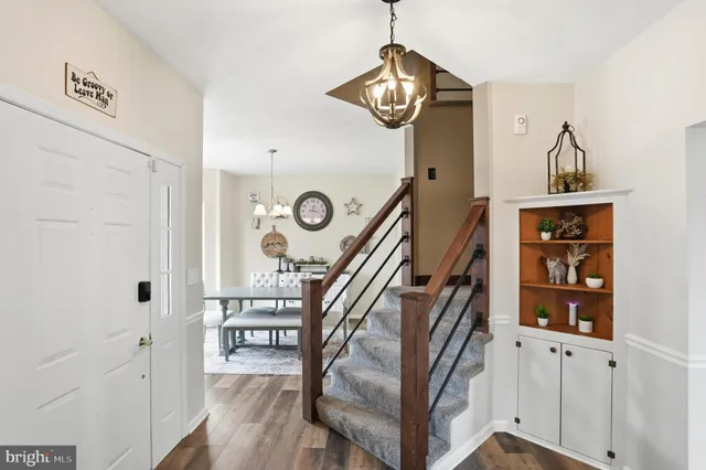 workspace with wooden floor windows and entryway