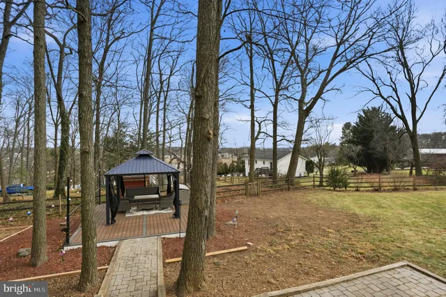 a utility room with multiple dryer and washer