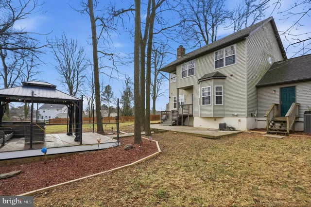 a view of a patio with table and chairs