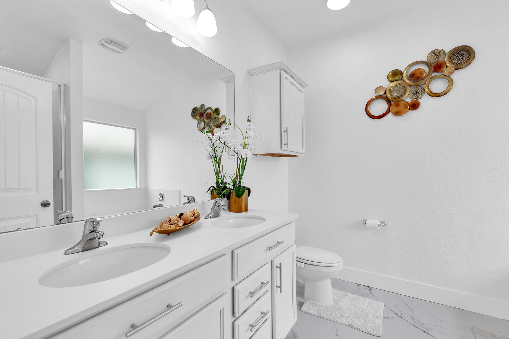 119 Beth Ann Loop Taylor, TX 76574 - Photo 25 of 31 Double vanity and elegant fixtures enhance this well-appointed bathroom.