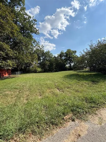 a view of a garden with a building