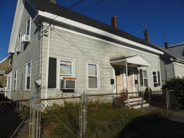 a view of house with yard