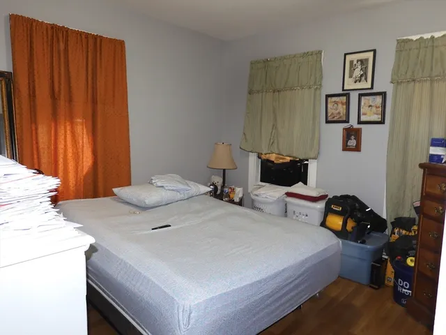 a bathroom with a sink a toilet and a shower