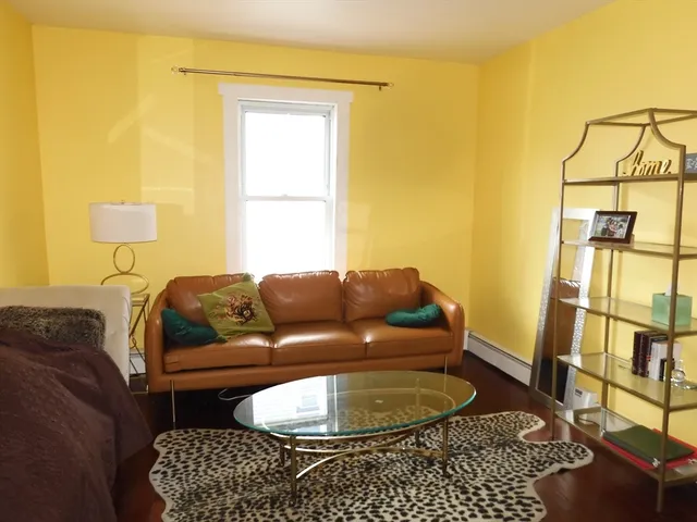 a living room with a couch and a table