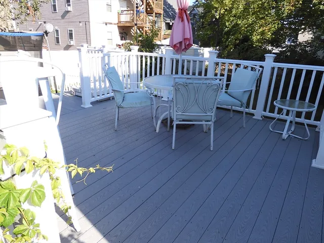a wooden fence with some trees in the background