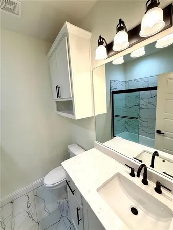 a bathroom with a sink and mirror
