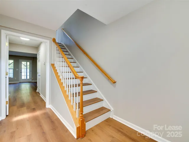 a view of a hallway with staircase