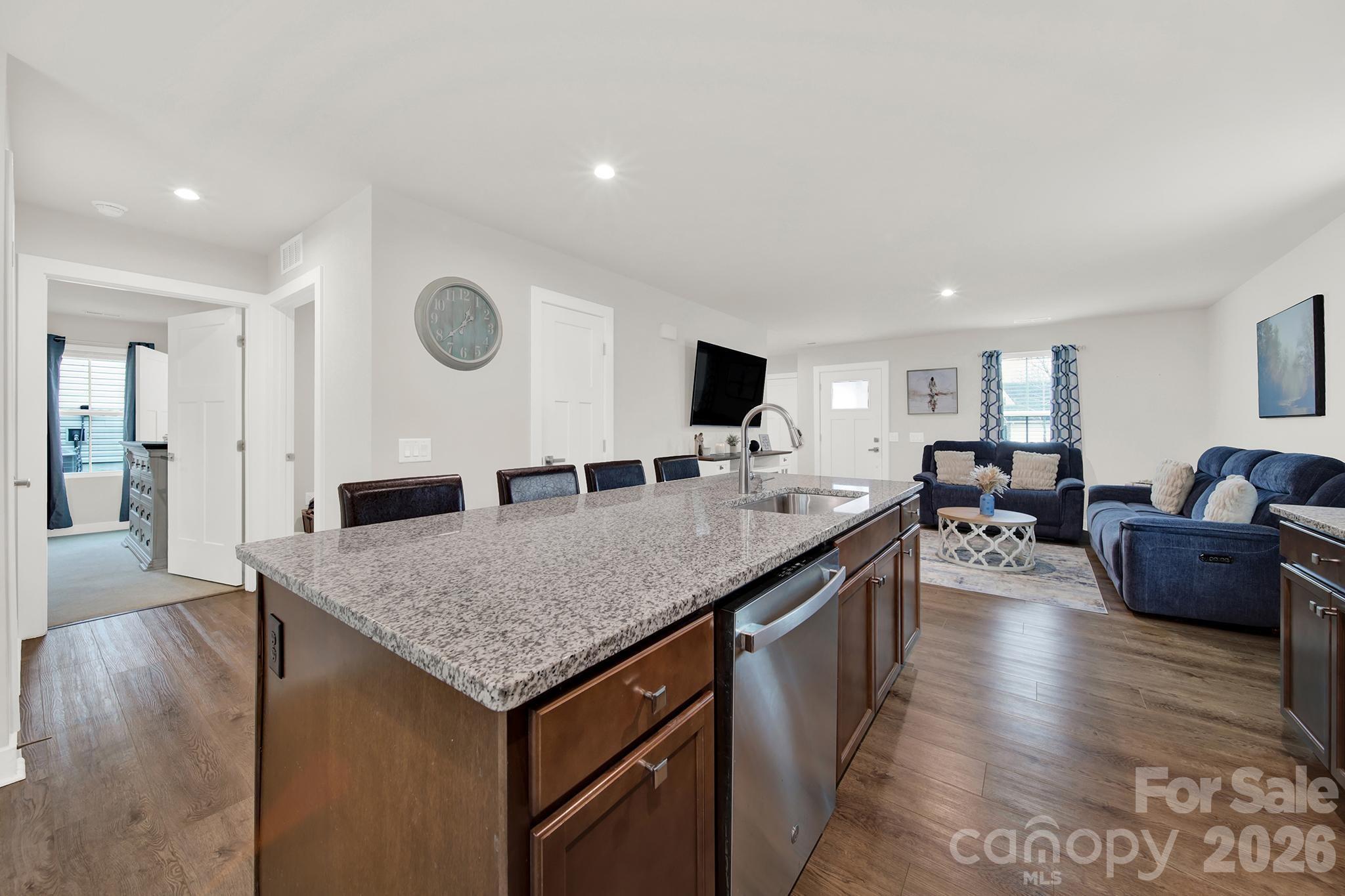 515 Grandiflora Avenue Lancaster, SC 29720 - Photo 11 of 29 a view of living room with granite countertop couches with wooden floor