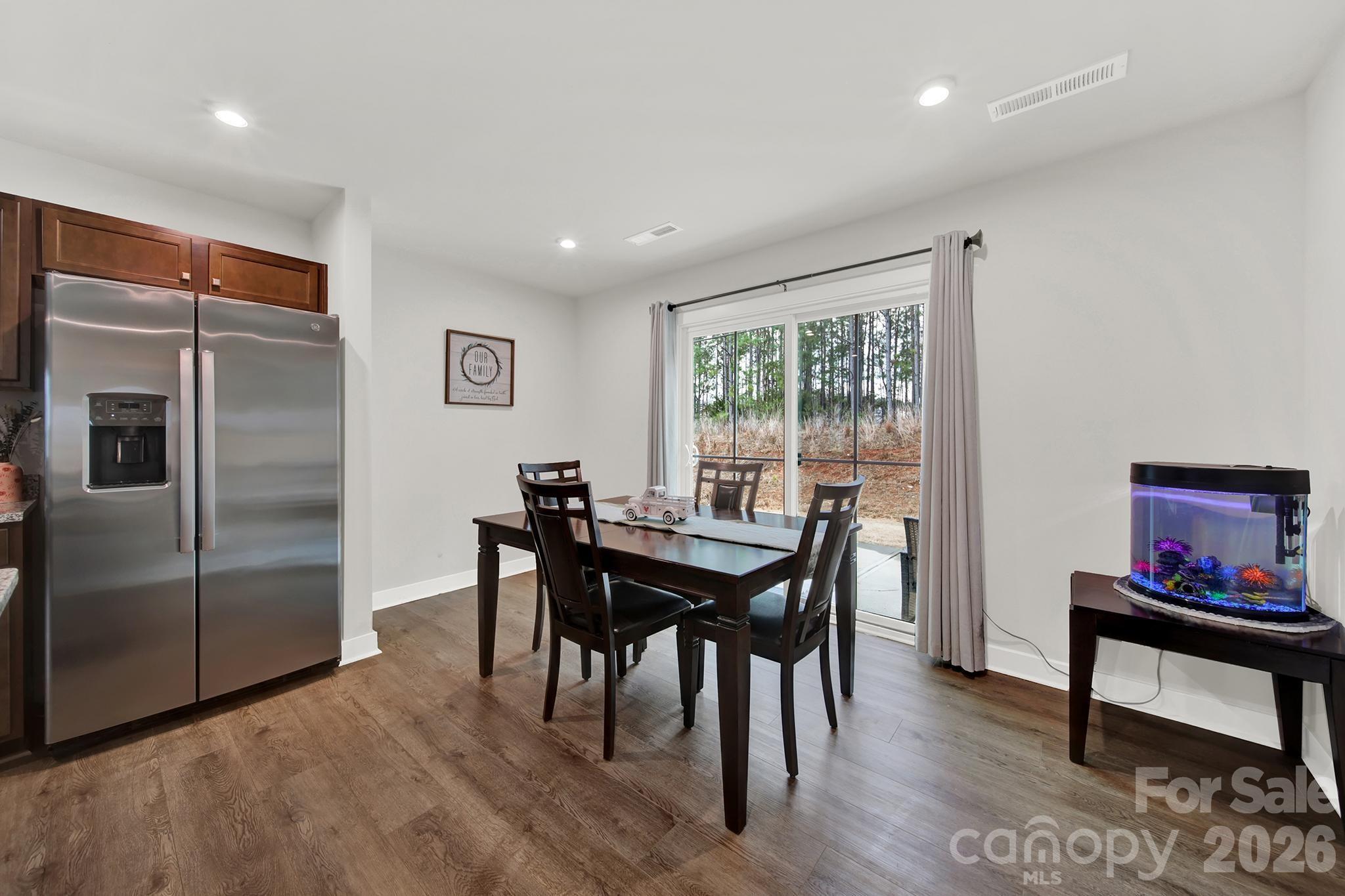 515 Grandiflora Avenue Lancaster, SC 29720 - Photo 13 of 29 a view of a dining room with furniture window and wooden floor