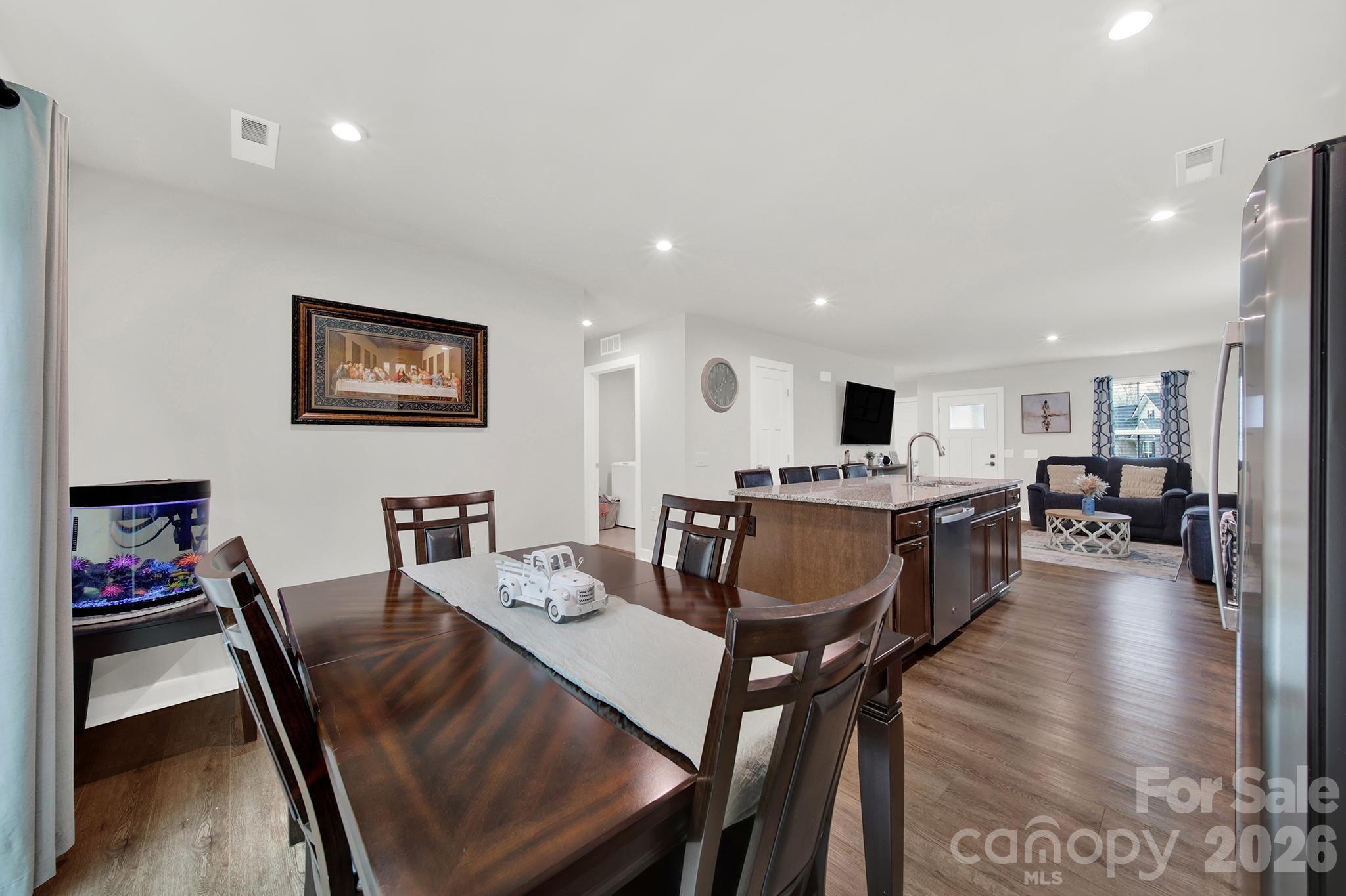 515 Grandiflora Avenue Lancaster, SC 29720 - Photo 14 of 29 a view of a dining room with furniture and wooden floor