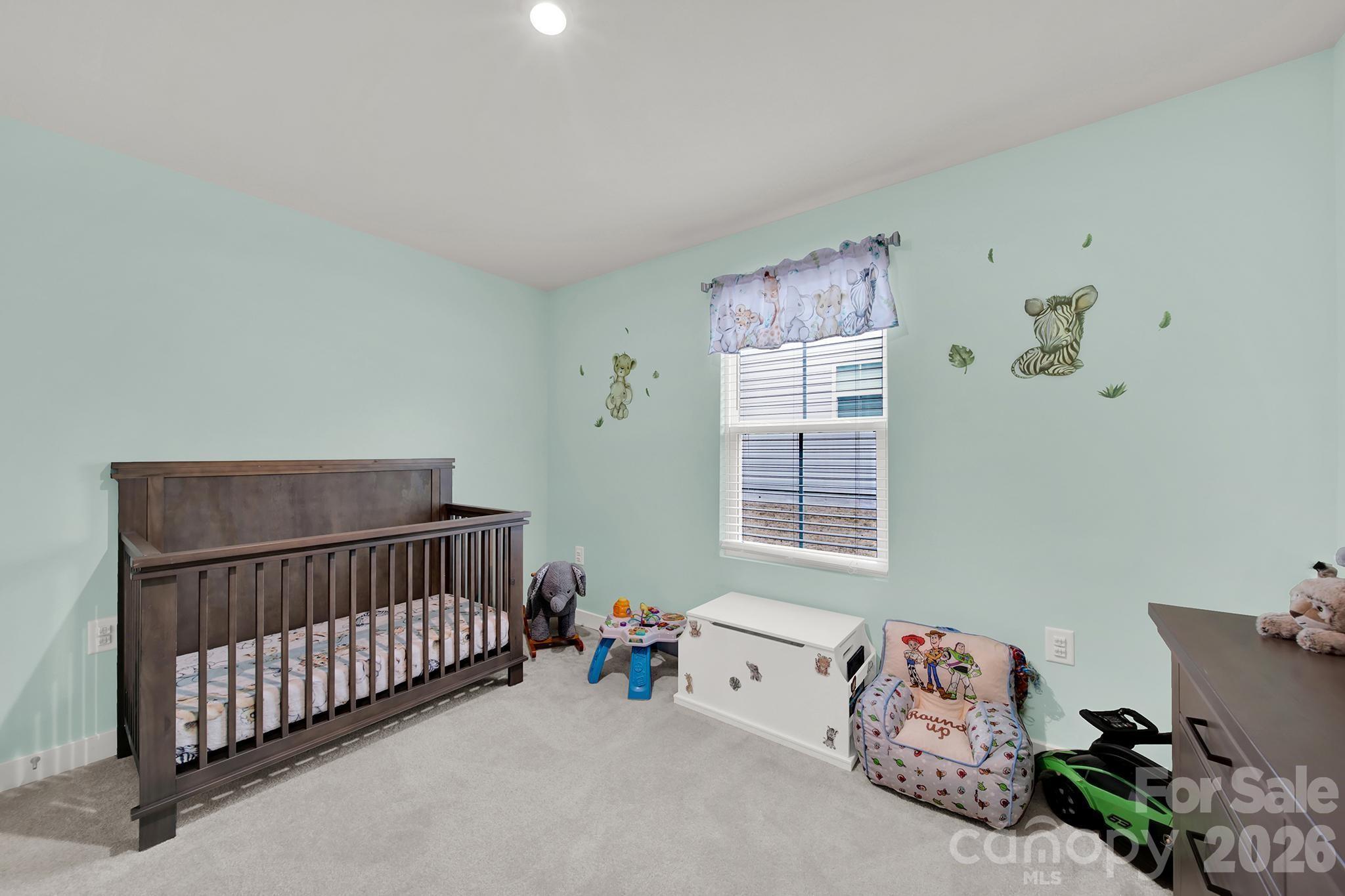 515 Grandiflora Avenue Lancaster, SC 29720 - Photo 15 of 29 a bedroom with a bed and window