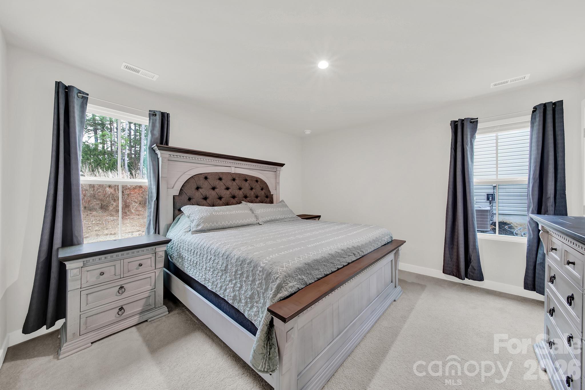 515 Grandiflora Avenue Lancaster, SC 29720 - Photo 19 of 29 a bedroom with a bed and a window