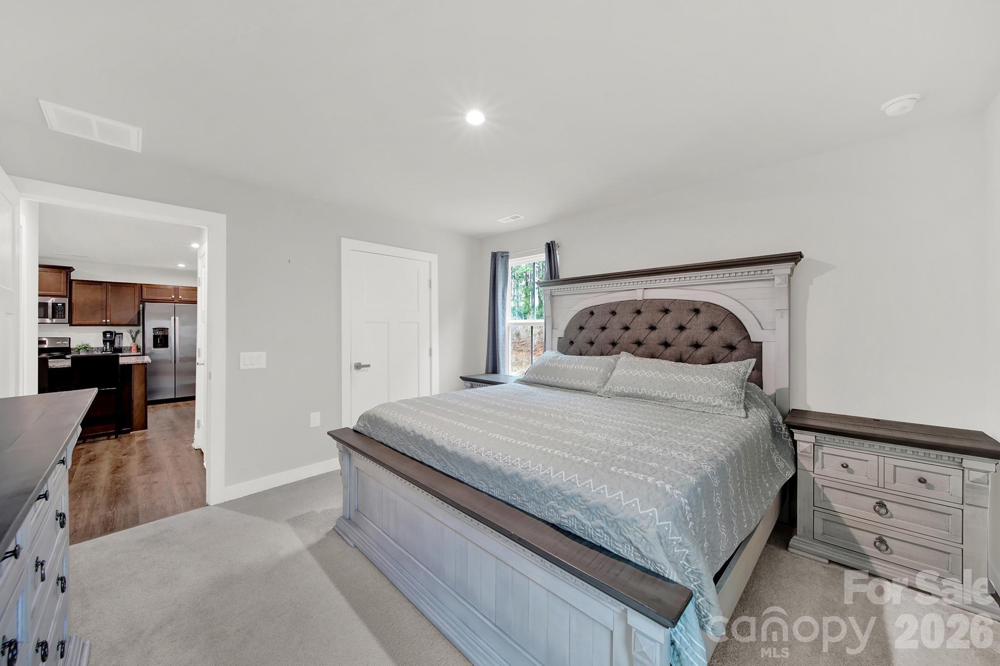 515 Grandiflora Avenue Lancaster, SC 29720 - Photo 20 of 29 a bedroom with a bed and cabinet
