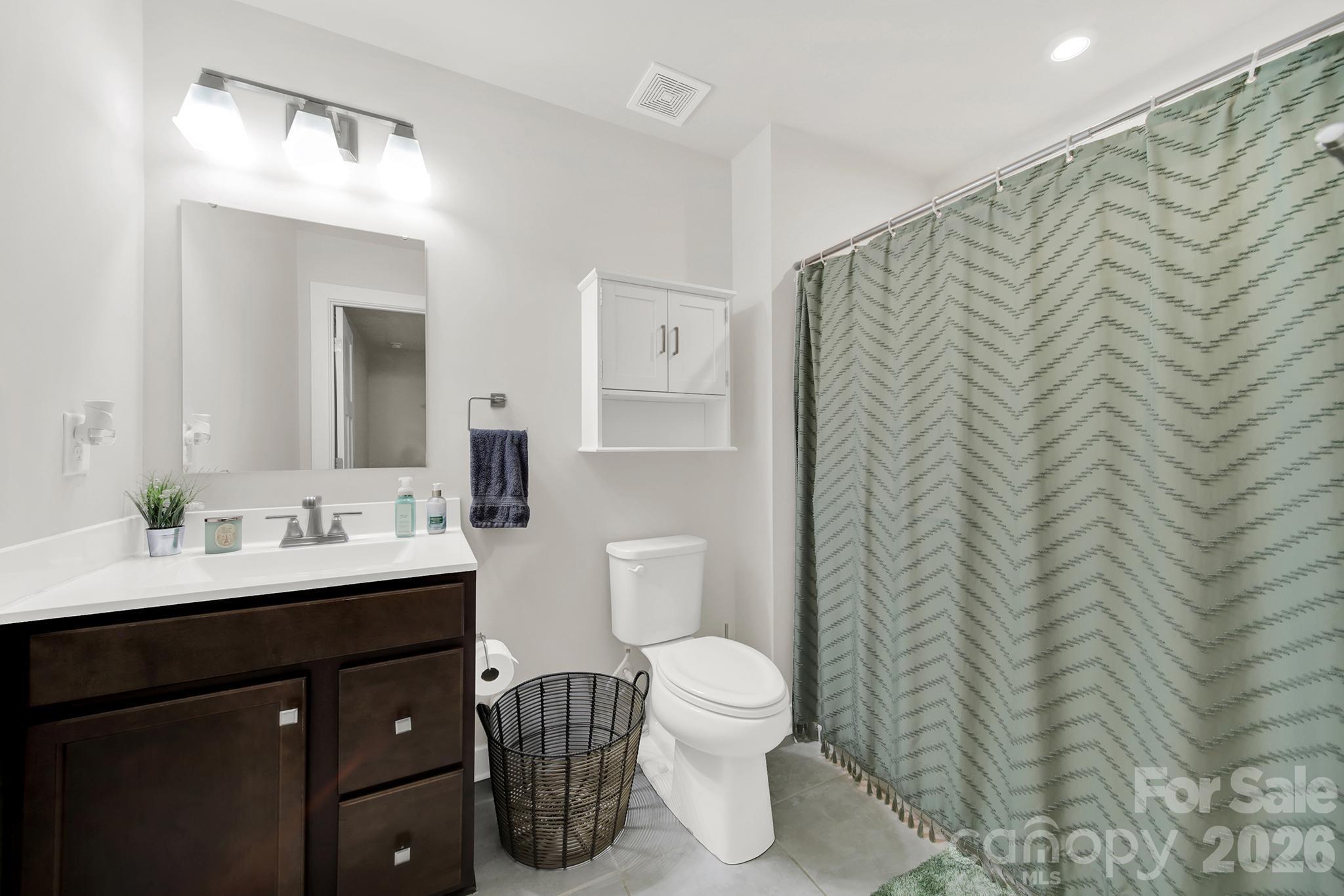 515 Grandiflora Avenue Lancaster, SC 29720 - Photo 23 of 29 a bathroom with a sink toilet and mirror
