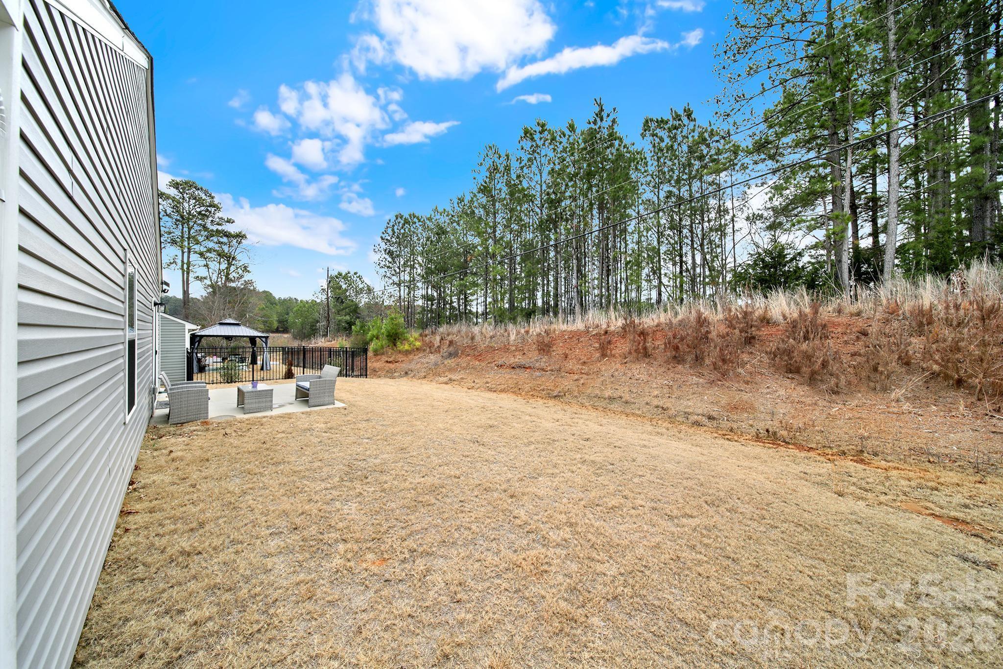 515 Grandiflora Avenue Lancaster, SC 29720 - Photo 25 of 29 a view of a backyard of the house
