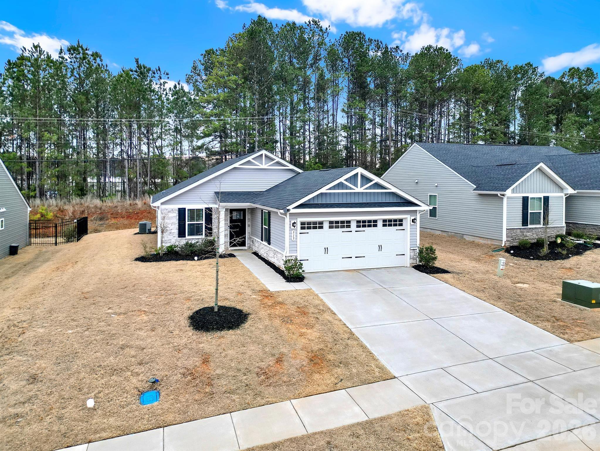 515 Grandiflora Avenue Lancaster, SC 29720 - Photo 26 of 29 a house with trees in the background