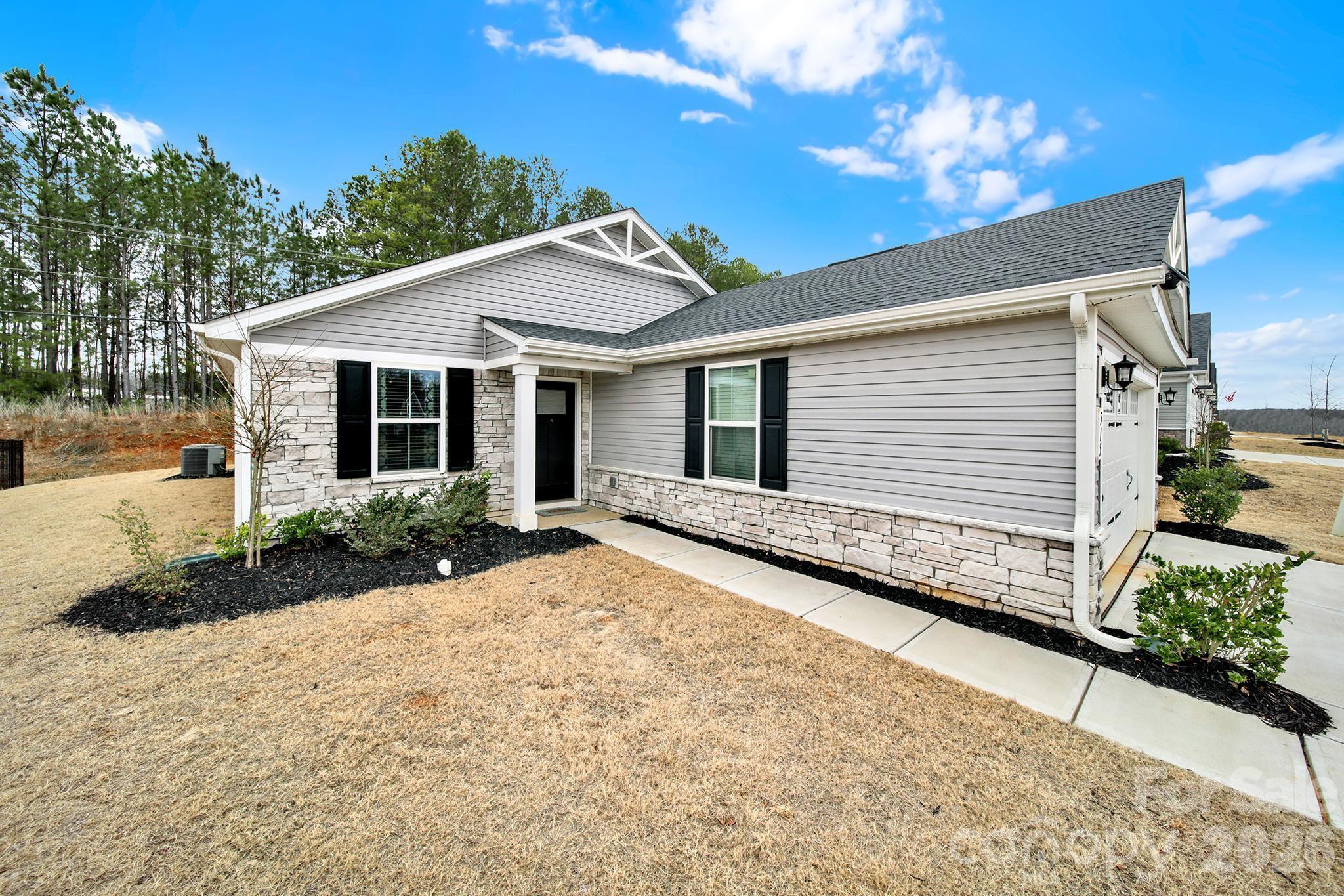 515 Grandiflora Avenue Lancaster, SC 29720 - Photo 4 of 29 a front view of a house with a yard