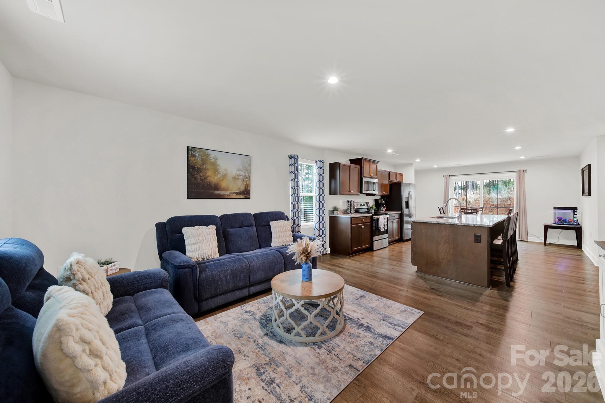 515 Grandiflora Avenue Lancaster, SC 29720 - Photo 6 of 29 a living room with furniture and a wooden floor