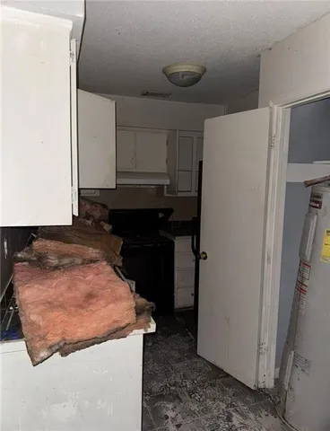 a kitchen with a refrigerator and a sink