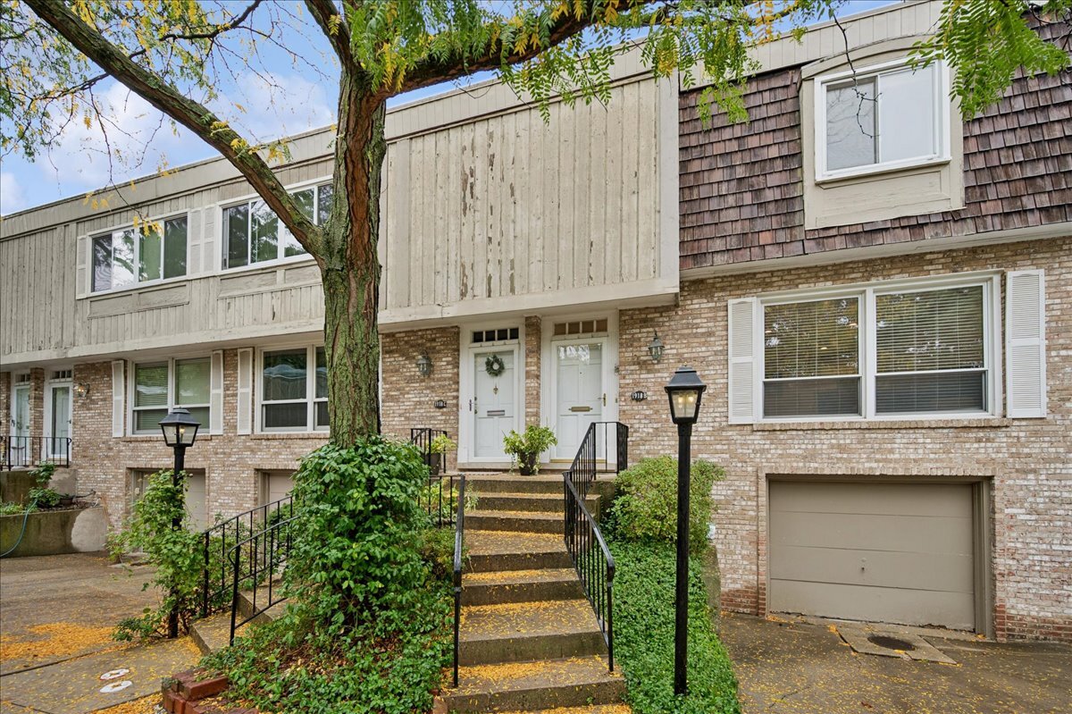 1918 Wilmette Avenue, Unit B Wilmette, IL 60091 - Photo 1 of 26 a front view of a house with a garden and plants