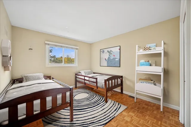 a bedroom with furniture and a window