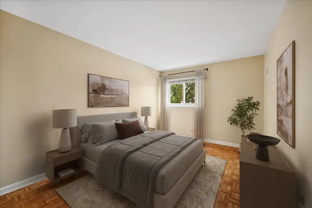 a bedroom with a bed and a potted plant