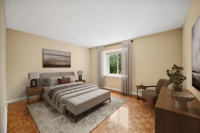 a bedroom with a bed and a potted plant