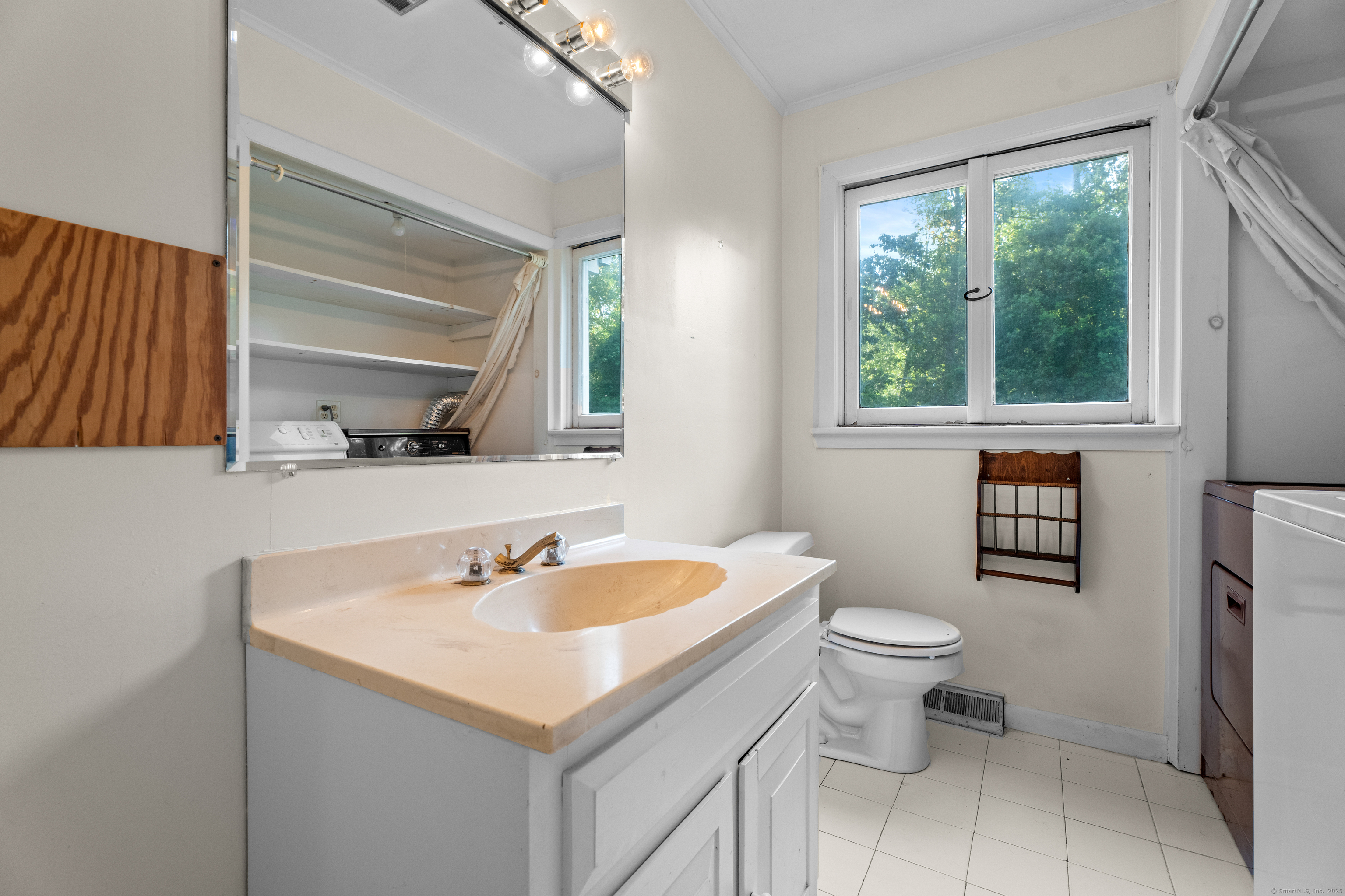 55 Harbor View Road Guilford, CT 06437 - Photo 11 of 38 a bathroom with a sink and a toilet