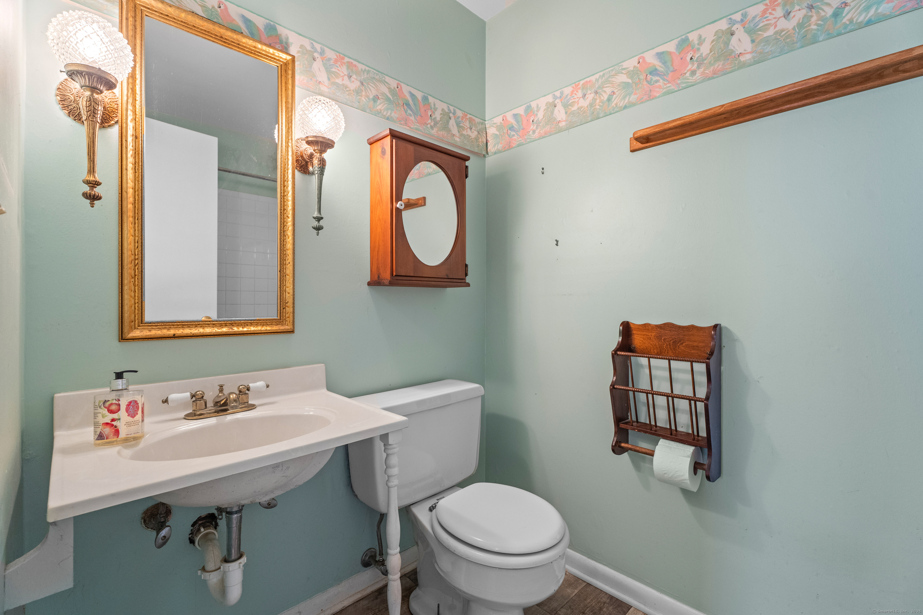 55 Harbor View Road Guilford, CT 06437 - Photo 13 of 38 a bathroom with a sink mirror vanity and toilet