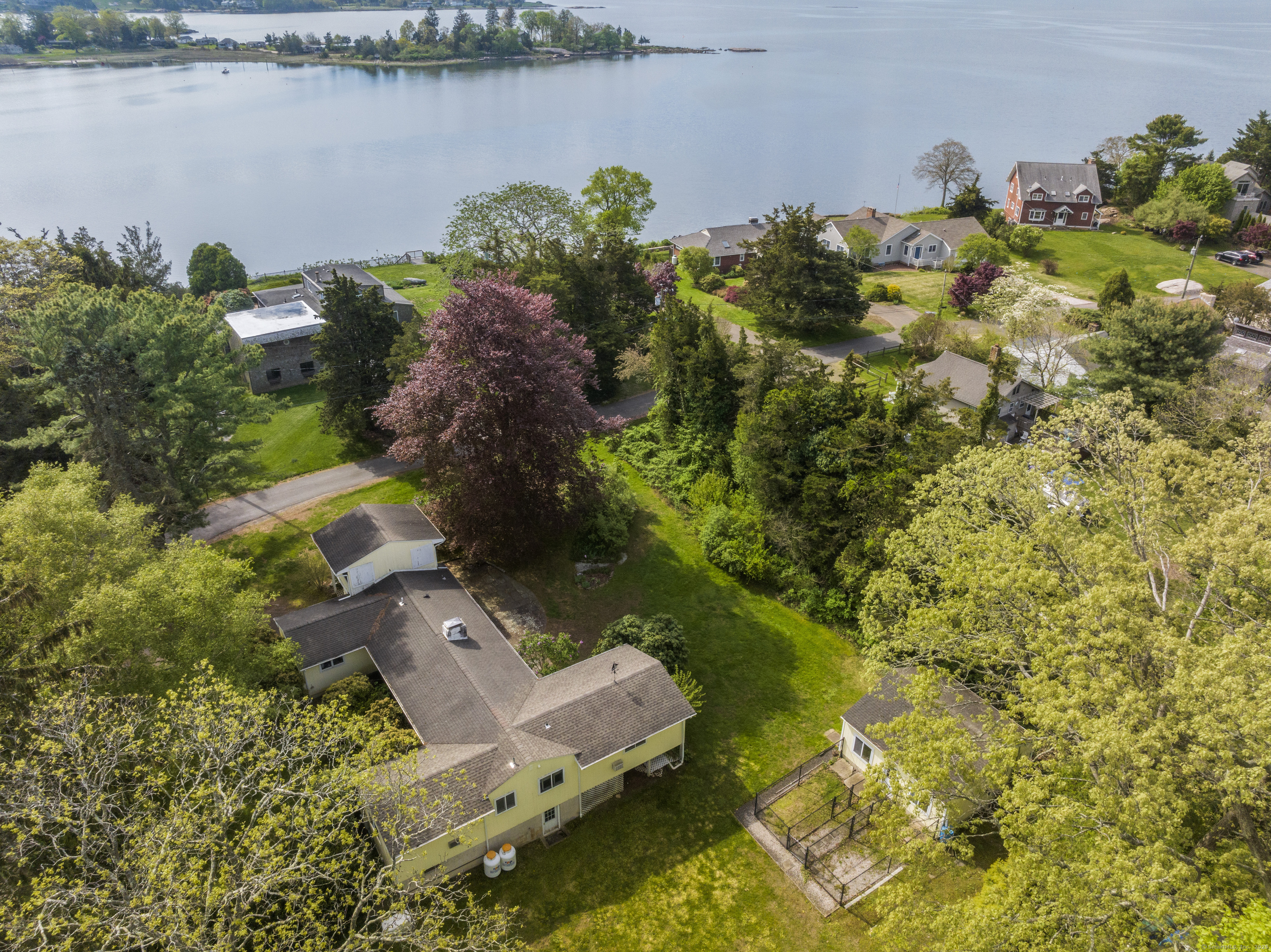55 Harbor View Road Guilford, CT 06437 - Photo 20 of 38 an aerial view of a house with a lake view