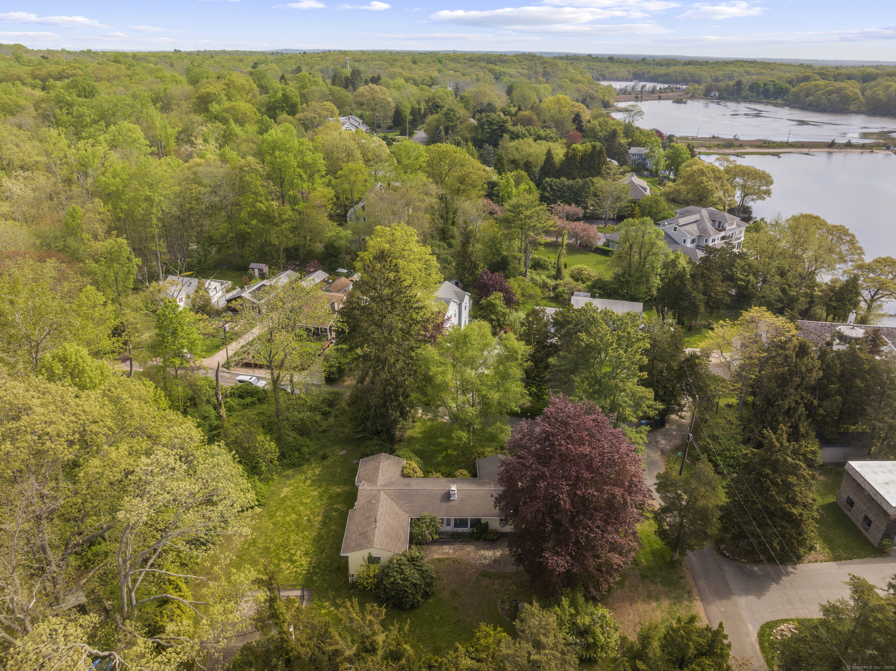 55 Harbor View Road Guilford, CT 06437 - Photo 22 of 38 a view of a lake with a mountain
