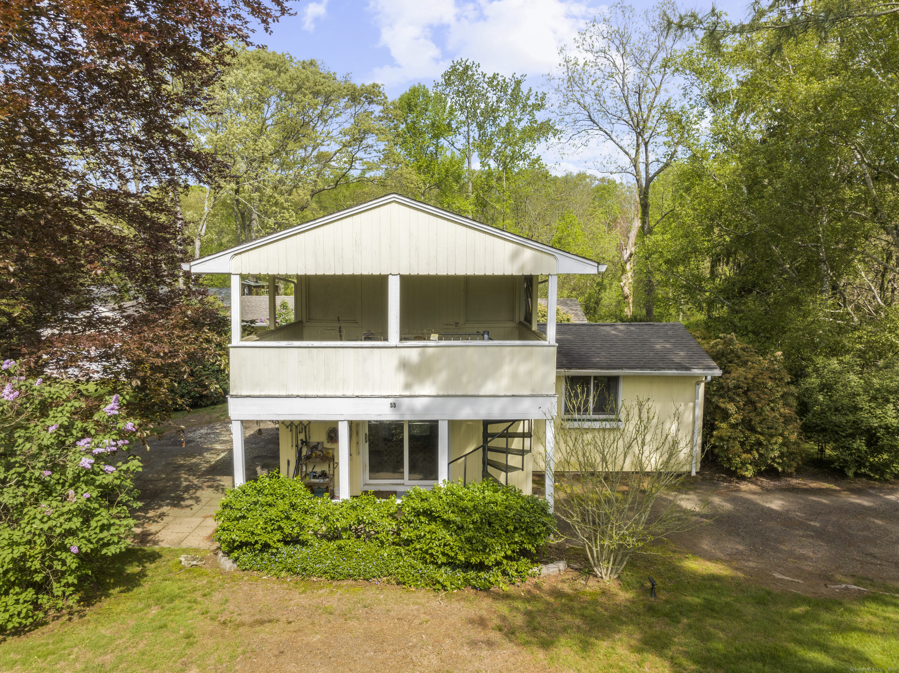 55 Harbor View Road Guilford, CT 06437 - Photo 23 of 38 a house with trees in the background